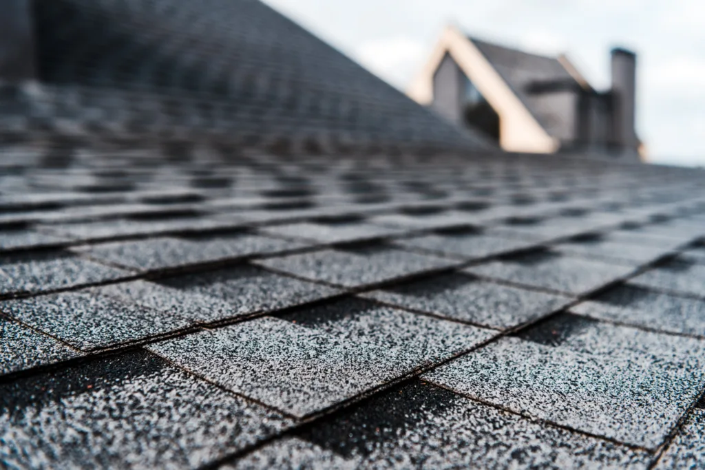 Close-up of dark architectural asphalt shingles on a roof